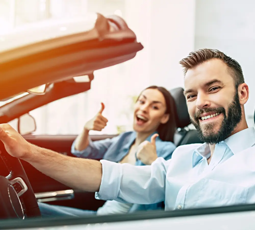 Satisfied customers with a rental car